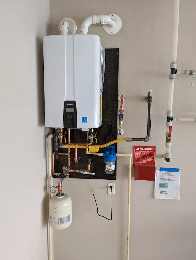 Professional plumber installing copper piping in a District Heights home